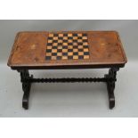 A 19TH CENTURY INLAID CENTRE TABLE with central chess board, flanked by two floral swags,