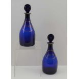 A PAIR OF GEORGIAN COBALT BLUE DECANTERS, with stoppers, gilt label decoration, "Rum" and "Shrub",