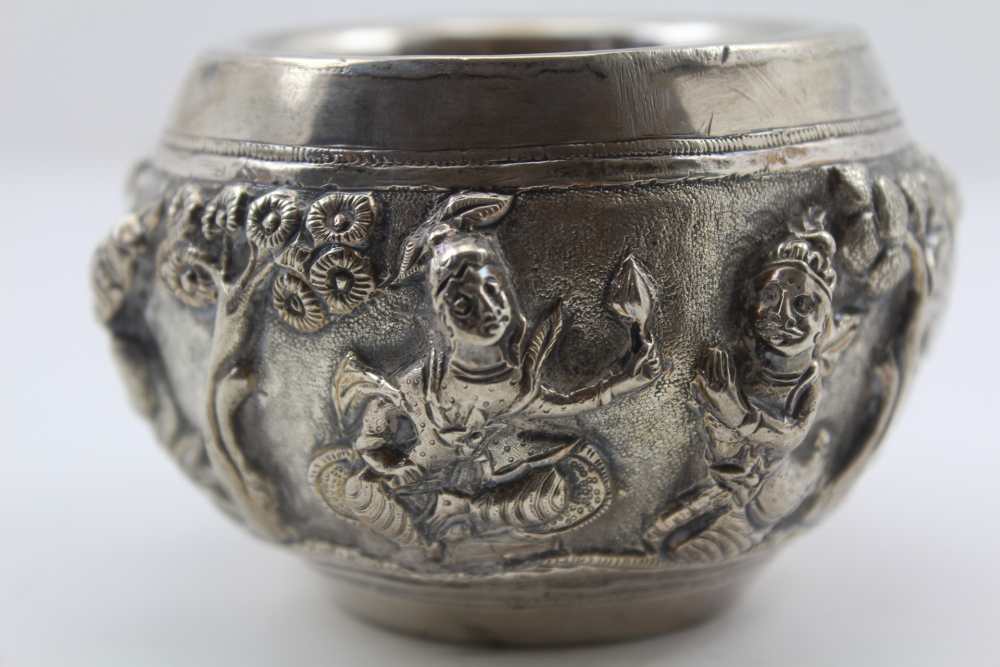 AN EASTERN WHITE METAL BOWL, repousse decoration in the round of warriors in a landscape, 6.5cm - Image 2 of 4