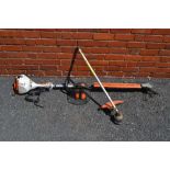 A STIHL MULTI-TOOL HEDGE TRIMMER / STRIMMER, model KM56, together with EYE & EAR DEFENDERS, complete