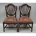 A PAIR OF 19TH CENTURY MAHOGANY SHIELD BACK SINGLE CHAIRS, with woolwork tapestry drop-in seats
