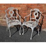 A PAIR OF 20TH CENTURY PAINTED CAST METAL ARMCHAIRS, decorated with fruit and vine, currently