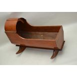 A 19TH CENTURY PINE & MAHOGANY ROCKING CHILD'S CRIB, of typical plank form & construction, 69cm x