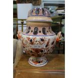 A POTTERY RETICULATED TABLE LAMP BASE decorated in the Imari palette