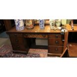 AN OAK FINISHED TWIN PEDESTAL DRESSING TABLE with plain mirror back