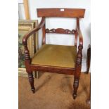 A 19TH CENTURY MAHOGANY FINISHED LOW BACKED ARMCHAIR with upholstered drop-in seat pad