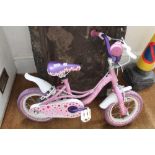 A SMALL PINK CHILD'S BICYCLE titled "Dolly Goes 2"