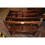 A REPRODUCTION MAHOGANY COLOURED CANTERBURY of typical form & construction
