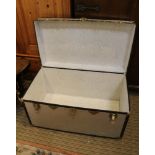 A METAL BOUND STEAMER TRUNK branded "Mossman"