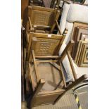 A SET OF FOUR REPRODUCTION OAK FINISHED DINING CHAIRS with portcullis carved backs and solid seats