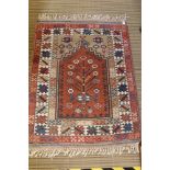 A SMALL WOVEN WOOLEN PRAYER RUG