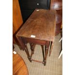 A LATE 19TH / EARLY 20TH CENTURY MAHOGANY FINISHED TWIN FLAP TABLE on turned slender legs, with