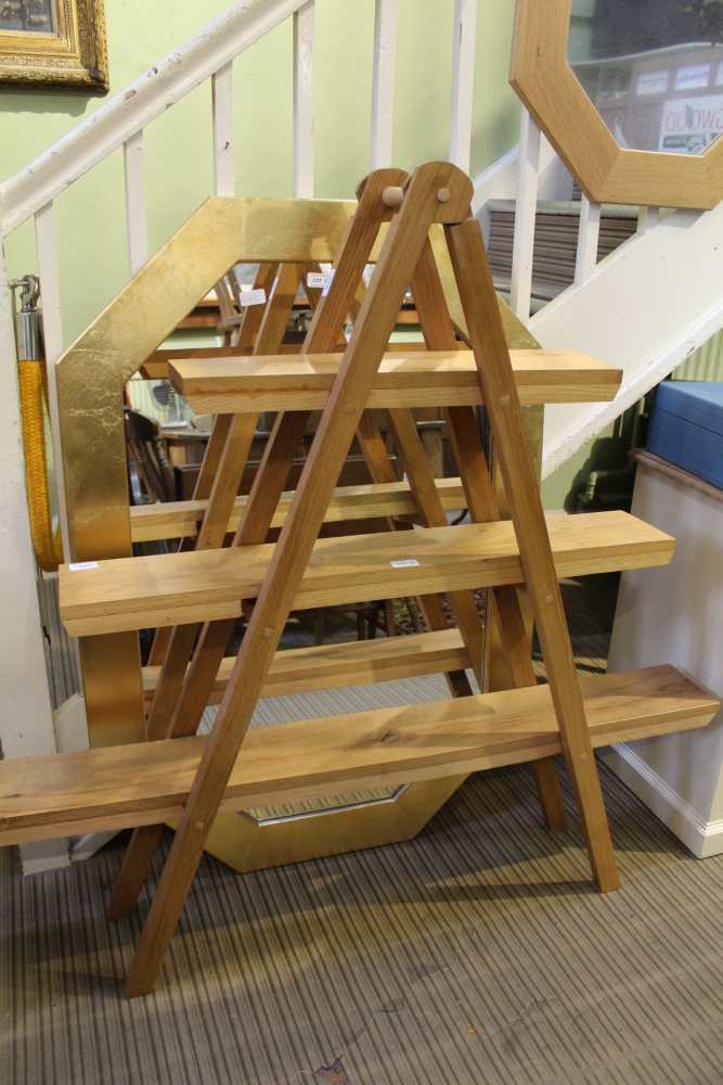 A HAND-MADE MODERNIST FOLDING THREE-TIER SET OF DISPLAY SHELVES