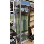 A GLASS SIDED FREE-STANDING DISPLAY CABINET in excess of 6ft