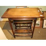 AN OAK FINISHED SWIVEL TOPPED FOLDING CARD TABLE, having folding undertier