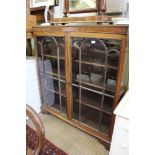 A LATE 19TH/EARLY 20TH CENTURY MAHOGANY FINISHED BOOKCASE UNIT having fancy bar glazed twin doors