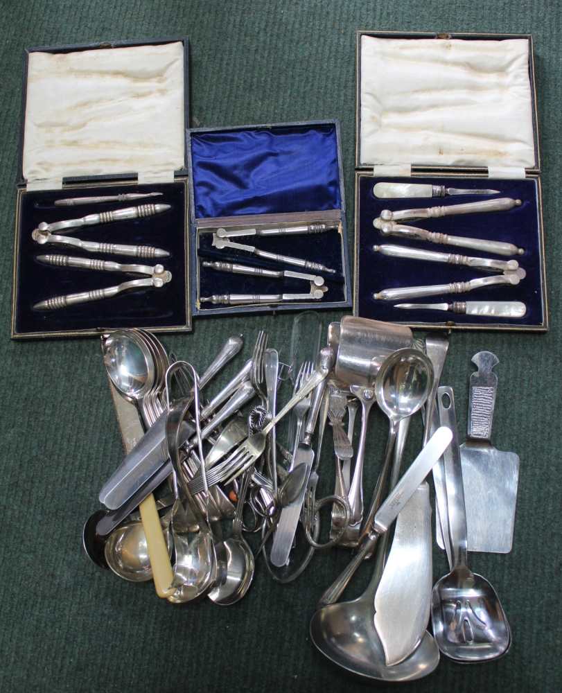 A BOX CONTAINING A SELECTION OF CUTLERY AND SERVING UTENSILS VARIOUS