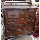 A WELL-MADE REPRODUCTION MAHOGANY FINISHED SERPENTINE FRONTED FOUR DRAWER CHEST with brushing slide