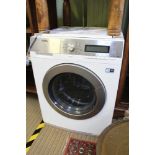 A WHITE FINISHED UNDERCOUNTER AEG BRANDED WASHING MACHINE with steam function