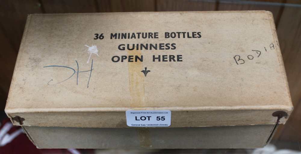 A BOX CONTAINING EIGHTEEN MINIATURE GUINESS BOTTLES