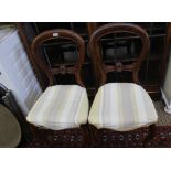 A PAIR OF 19TH CENTURY MAHOGANY BALLOON BACK SINGLE CHAIRS with upholstered seat pads and cabriole