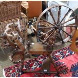 AN ANTIQUE WOODEN SPINNING WHEEL