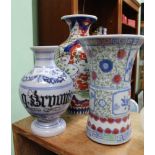 TWO ORIENTAL PORCELAIN VASES together with a Continental reproduction pottery CHEMISTS DRUG JAR