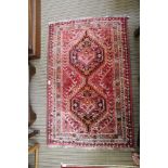 A SMALL SIZED WOVEN WOOLEN FLOOR RUG