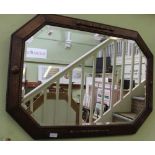 AN OAK BEADED FRAMED BEVELLED WALL MIRROR