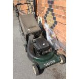 A PETROL DRIVEN HAYTER ROTARY MOWER, with grass collection box and other accessories