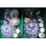 TWO CRATES CONTAINING A LARGE SELECTION OF DOMESTIC POTTERY the majority blue & white decorated, for