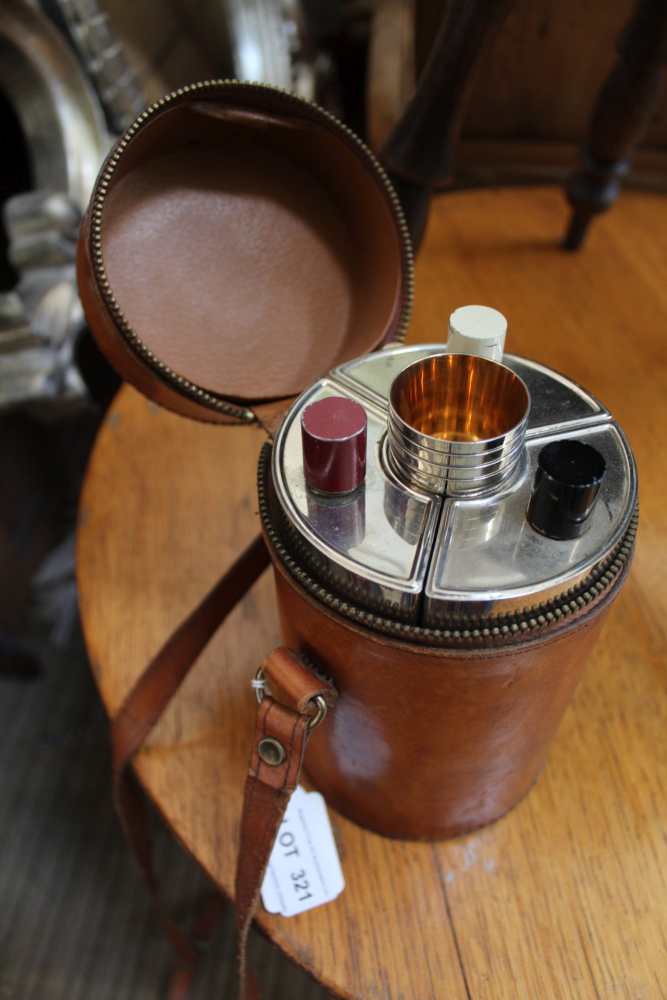 A LEATHER CASED MULTI-BOTTLE FLASK with tumbler cups