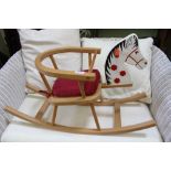 A BEECH FRAMED SMALL SIZED CHILD'S ROCKING HORSE