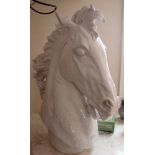 A NEAR LIFE SIZE WHITE GLAZED POTTERY HORSES HEAD