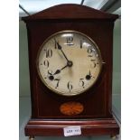 A LATE 19TH / EARLY 20TH CENTURY MAHOGANY CASED MANTEL CLOCK with inlaid panel, supported on four