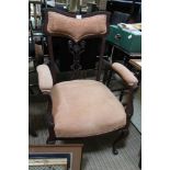 AN ART NOUVEAU DESIGN ARMCHAIR with upholstered back, arm and seat pads