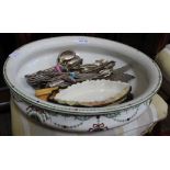 A POTTERY TOILET BOWL CONTAINING A SELECTION OF CUTLERY, and a Lock & Co. Of Worcester porcelain