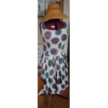 AN ADJUSTABLE DRESSMAKER'S DUMMY on metal stand, together with a retro dress and a woven sun hat