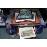 A BLUE GLASS & METAL OIL LAMP together with a carved wooden tray and a small selection of prints