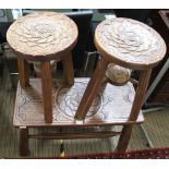 THREE CARVED WOODEN STOOLS, two circular with flower head tops and undertiers, one rectangular, each