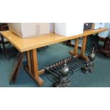 A LIGHT OAK FINISHED RECTANGULAR TOP REFRECTORY TABLE on Cotswold school style supports