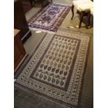 TWO WOVEN WOOLLEN FLOOR RUGS, on having animal pattern border, the other standard geometric field