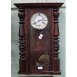 A MAHOGANY CASED VIENESSE STYLE HANGING WALL CLOCK