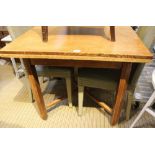 A FIRST QUARTER 20TH CENTURY OAK SQUARE TOPPED DRAWLEAF DINING TABLE supported on four plain