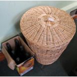 A WOVEN WICKER WORK LINEN BASKET together with six bottles of HARDY'S CHARDONNAY SAUVIGNON