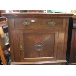 A PROBABLE CONTINENTAL OAK SIDE UNIT having plain top over single drawer and decorative panelled