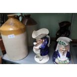 A BIRMINGHAM STONEWARE SPIRIT FLAGON, together with four Toby jugs various