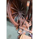 A WOODEN SPINNING WHEEL currently dismantled for ease of transportation