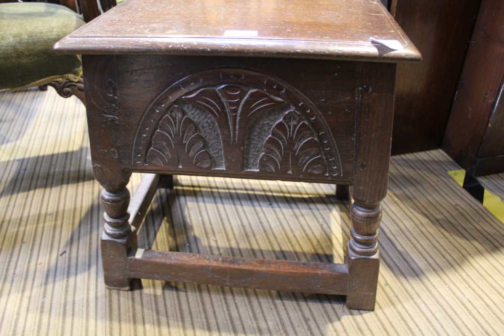 A SMALL BOX TOPPED STOOL