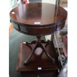 A REPRODUCTION SMALL SIZED DRUM TABLE